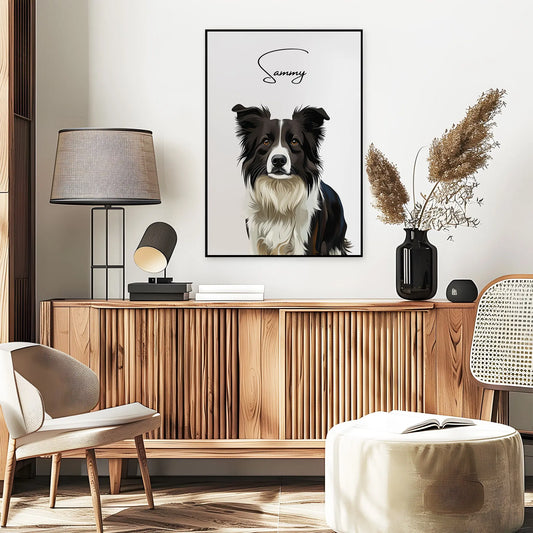 Tierportrait eines schwarz weißen Collies im modernen Vektor-Stil auf Fine-Art Papier im schwarzen Bilderrahmen 50x70 cm. Frontal an einer Wand hängend. Darunter ein Sideboard mit einer Lampe und einer Vase mit Graesern.