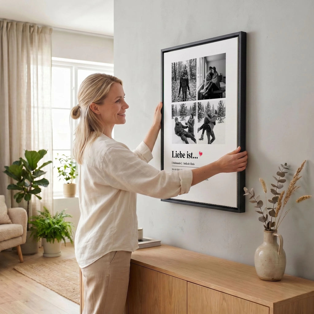 Frau hängt Leinwand auf 34 black