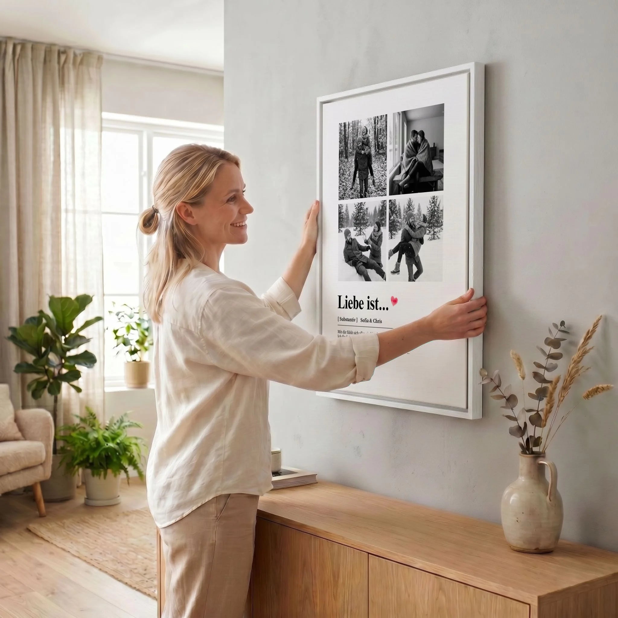Frau hängt Leinwand auf 34 weiss