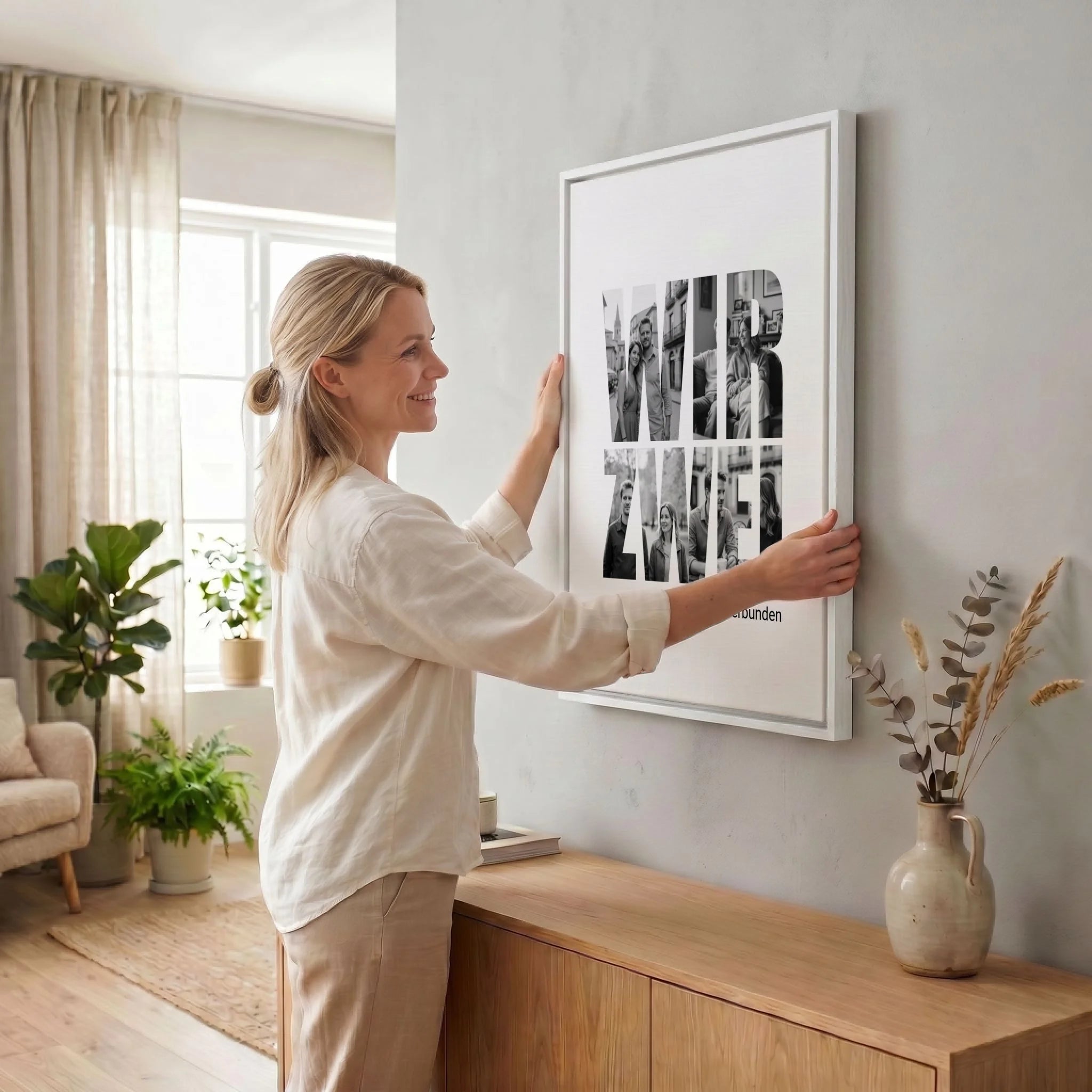Frau hängt Leinwand auf 34 weiss